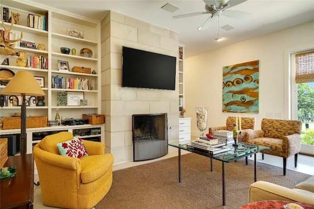 281 Kendall Jackson, Comfort, TX 78013 - carpeted living room featuring a fireplace, ceiling fan, and built in features