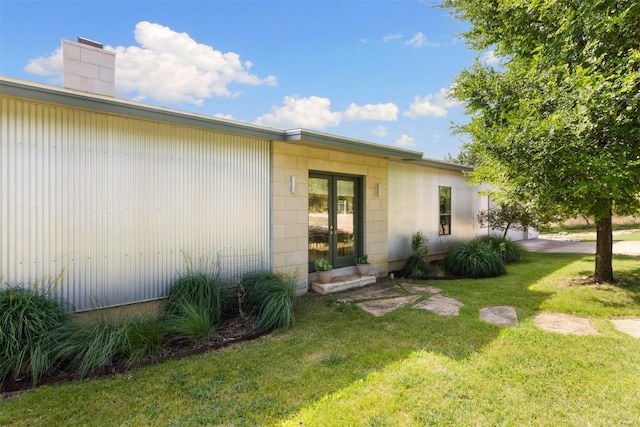 281 Kendall Jackson, Comfort, TX 78013 - view of home's exterior featuring a lawn and a chimney