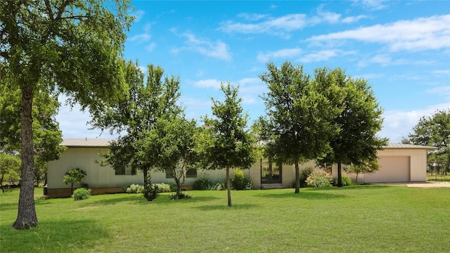 281 Kendall Jackson, Comfort, TX 78013 - view of green lawn with a garage, concrete driveway, and french doors