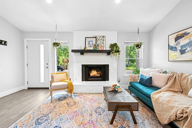 1804 Matthews Ln Unit B, Austin, TX 78745 - living area featuring wood finished floors, a fireplace, and recessed lighting