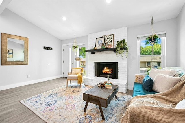 1804 Matthews Ln Unit B, Austin, TX 78745 - living room with a fireplace, wood finished floors, vaulted ceiling, and recessed lighting