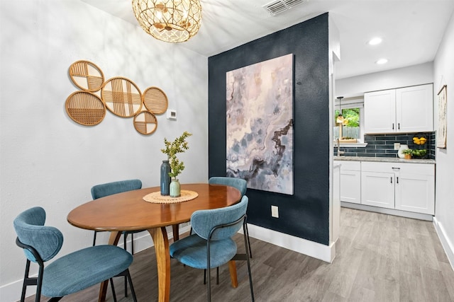 1804 Matthews Ln Unit B, Austin, TX 78745 - dining area featuring light wood-type flooring and recessed lighting
