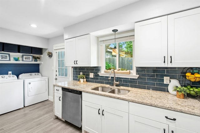 1804 Matthews Ln Unit B, Austin, TX 78745 - kitchen with stainless steel dishwasher, washing machine and dryer, decorative backsplash, white cabinets, and recessed lighting