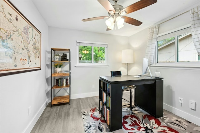1804 Matthews Ln Unit B, Austin, TX 78745 - home office featuring healthy amount of natural light, wood finished floors, and a ceiling fan