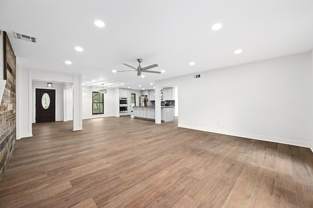 322 Mesa Oaks, Leander, TX 78641 - unfurnished living room with ceiling fan, wood finished floors, recessed lighting, and baseboards