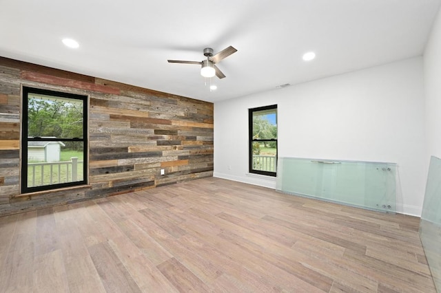 322 Mesa Oaks, Leander, TX 78641 - unfurnished room with wooden walls, wood finished floors, a ceiling fan, baseboards, and recessed lighting
