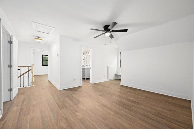 322 Mesa Oaks, Leander, TX 78641 - unfurnished living room with attic access, wood finished floors, baseboards, and ceiling fan