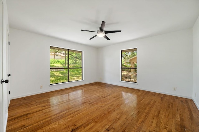 9803 Talleyran Dr, Austin, TX 78750 - spare room featuring plenty of natural light, wood finished floors, and ceiling fan