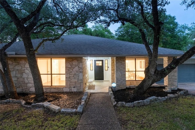 9803 Talleyran Dr, Austin, TX 78750 - view of front of property featuring stone siding and a shingled roof