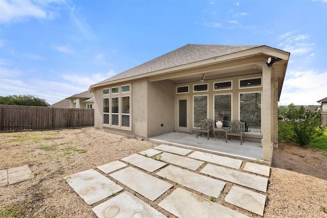 400 Saturnia Dr, Georgetown, TX 78613 - rear view of property featuring stucco siding, a patio area, and a shingled roof