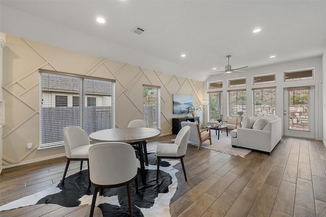 400 Saturnia Dr, Georgetown, TX 78613 - dining area with ceiling fan, wood finished floors, recessed lighting, a decorative wall, and an accent wall