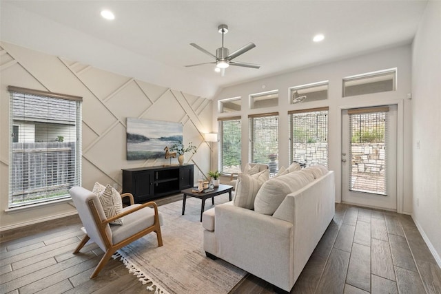 400 Saturnia Dr, Georgetown, TX 78613 - living room with plenty of natural light, wood finished floors, baseboards, vaulted ceiling, and recessed lighting