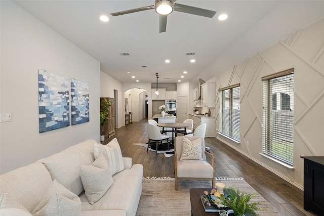400 Saturnia Dr, Georgetown, TX 78613 - living area featuring arched walkways, ceiling fan, dark wood-type flooring, and recessed lighting