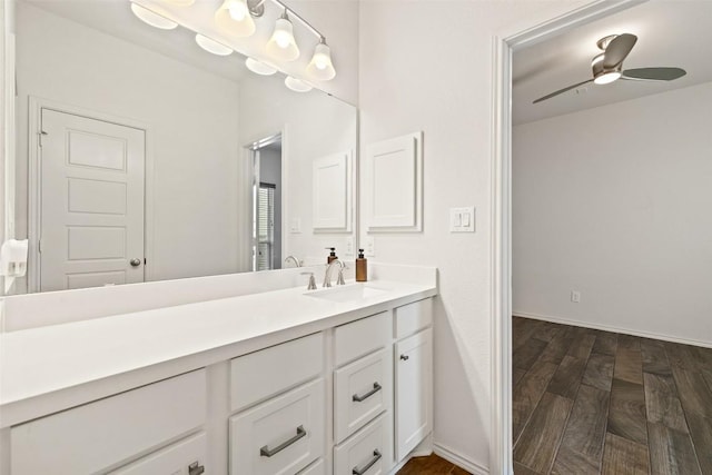 400 Saturnia Dr, Georgetown, TX 78613 - bathroom featuring vanity, ceiling fan, baseboards, and wood finished floors