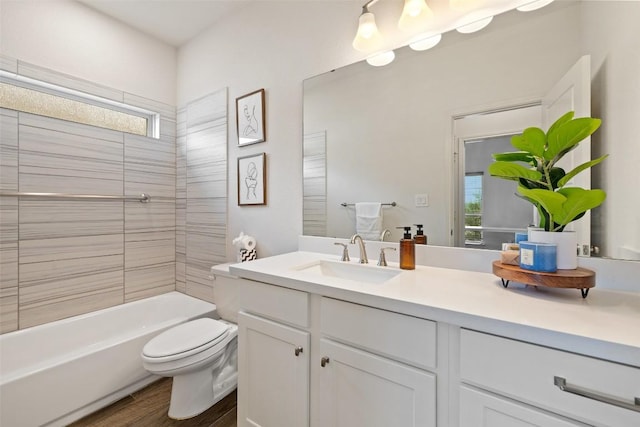 400 Saturnia Dr, Georgetown, TX 78613 - full bath featuring toilet, vanity, healthy amount of natural light, and wood finished floors