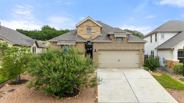 400 Saturnia Dr, Georgetown, TX 78613 - view of front of house with a shingled roof, brick siding, concrete driveway, and a garage