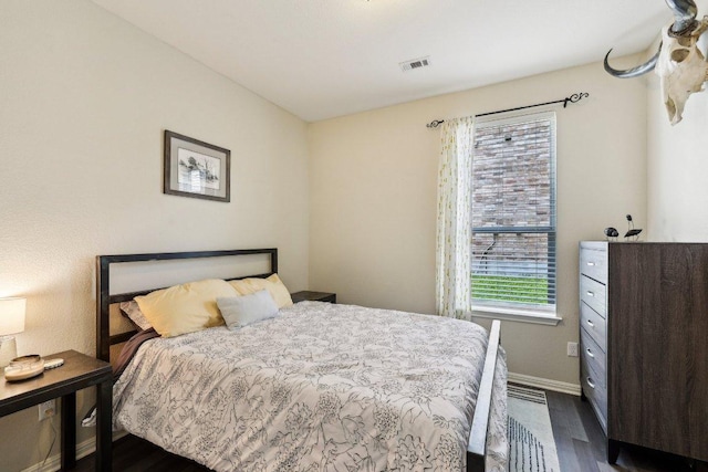 1312 Ravensbrook Bnd, Cedar Park, TX 78613 - bedroom with dark wood finished floors and baseboards