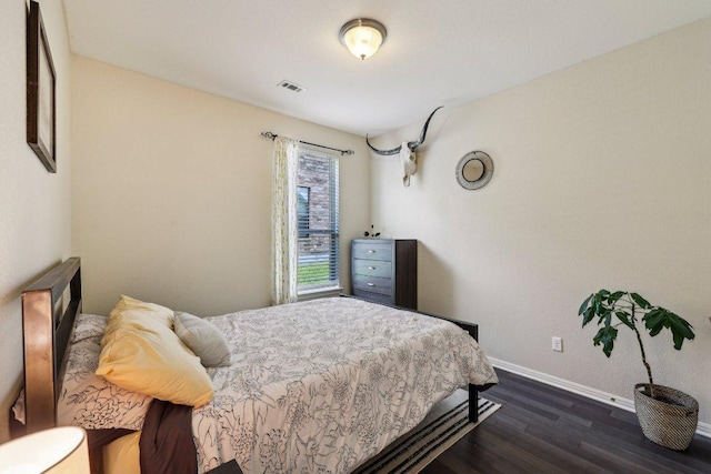 1312 Ravensbrook Bnd, Cedar Park, TX 78613 - bedroom featuring dark wood finished floors and baseboards