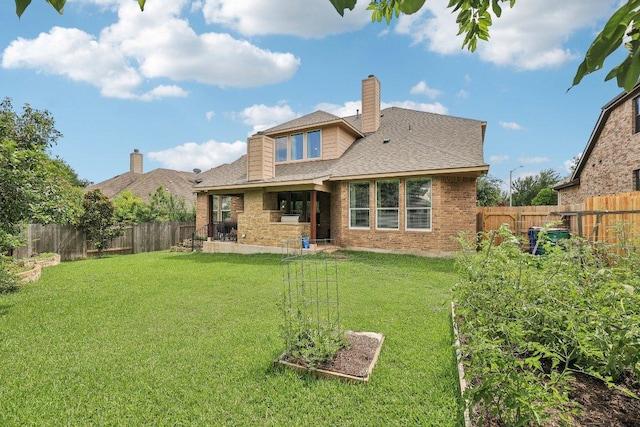 1312 Ravensbrook Bnd, Cedar Park, TX 78613 - rear view of property with a shingled roof, brick siding, and a chimney