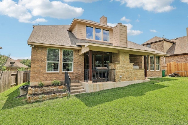 1312 Ravensbrook Bnd, Cedar Park, TX 78613 - rear view of house featuring a chimney and brick siding