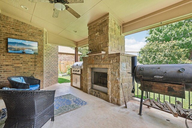 1312 Ravensbrook Bnd, Cedar Park, TX 78613 - view of patio / terrace featuring an outdoor stone fireplace, a ceiling fan, and a grill