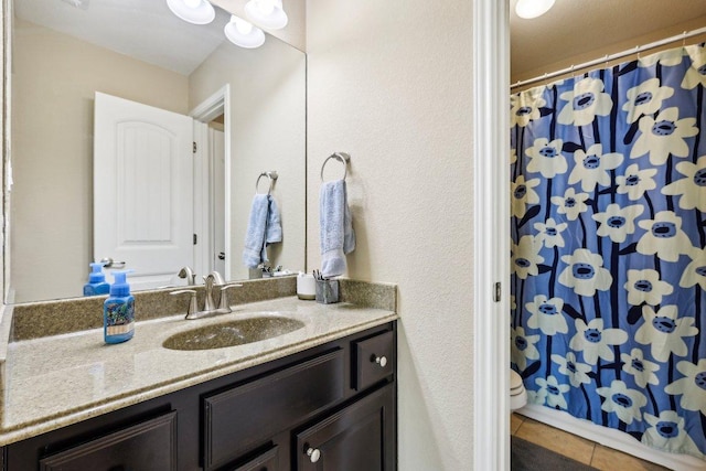 1312 Ravensbrook Bnd, Cedar Park, TX 78613 - full bathroom featuring vanity, tile patterned flooring, toilet, and a shower with shower curtain