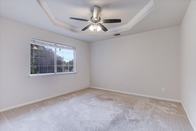13022 Hunters Chase Dr, Austin, TX 78729 - carpeted empty room with a raised ceiling, crown molding, a ceiling fan, and baseboards