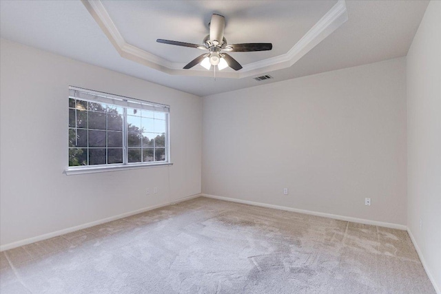 13022 Hunters Chase Dr, Austin, TX 78729 - carpeted empty room featuring a tray ceiling, ornamental molding, and ceiling fan