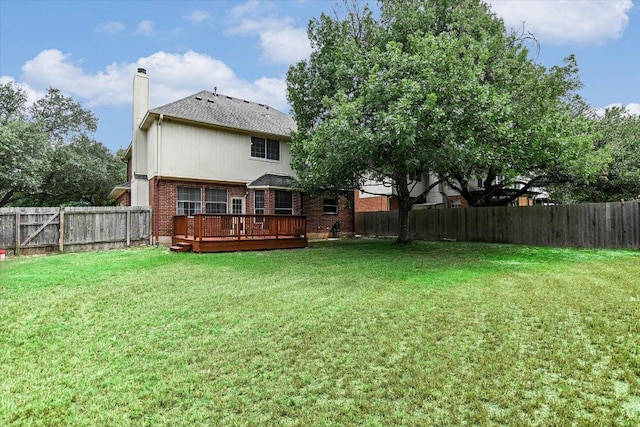 13022 Hunters Chase Dr, Austin, TX 78729 - back of house with brick siding, a wooden deck, a chimney, a fenced backyard, and a shingled roof