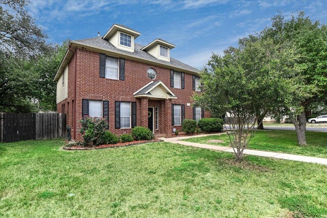 13022 Hunters Chase Dr, Austin, TX 78729 - colonial home featuring brick siding