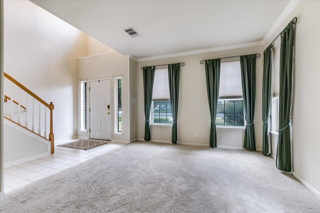 13022 Hunters Chase Dr, Austin, TX 78729 - tiled entryway with crown molding, stairway, carpet floors, and baseboards