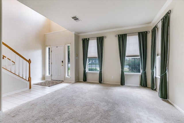 13022 Hunters Chase Dr, Austin, TX 78729 - carpeted entryway featuring ornamental molding, stairway, and tile patterned floors