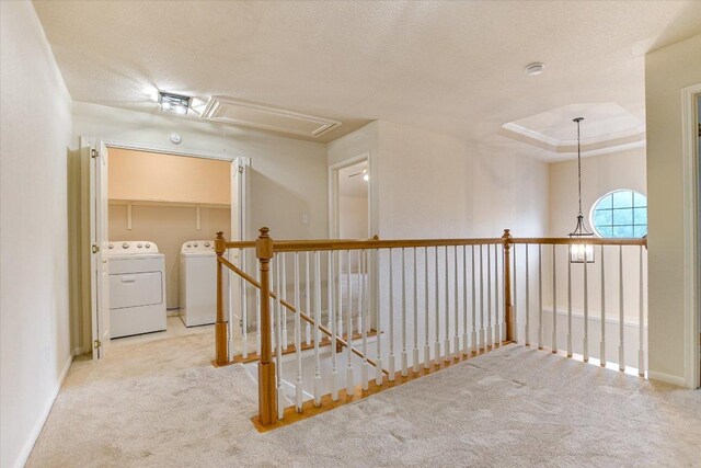 13022 Hunters Chase Dr, Austin, TX 78729 - hallway featuring attic access, washing machine and dryer, carpet, an upstairs landing, and baseboards