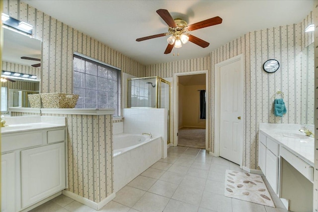 13022 Hunters Chase Dr, Austin, TX 78729 - bathroom with wallpapered walls, a ceiling fan, two vanities, a stall shower, and a garden tub