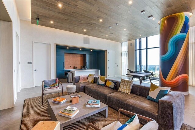 48 E Ave Unit 1210, Austin, TX 78701 - living room featuring wood ceiling, a high ceiling, and recessed lighting