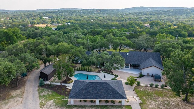 12203 Trailmaster Dr, Austin, TX 78737 - view of subject property featuring a pool area and a heavily wooded area