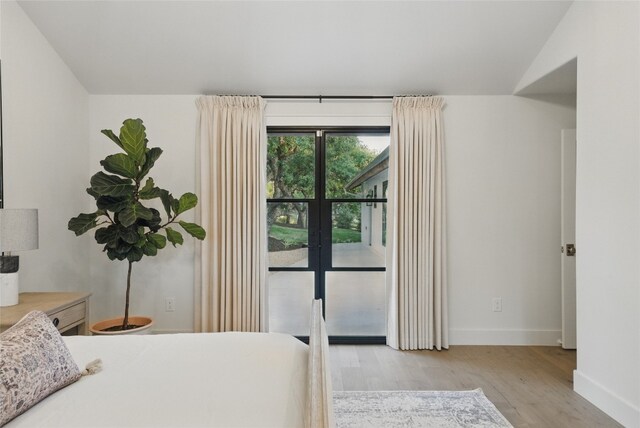 12203 Trailmaster Dr, Austin, TX 78737 - bedroom featuring light wood-type flooring, baseboards, and french doors