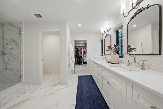 12203 Trailmaster Dr, Austin, TX 78737 - bathroom with a marble finish shower, double vanity, marble finish flooring, a spacious closet, and recessed lighting