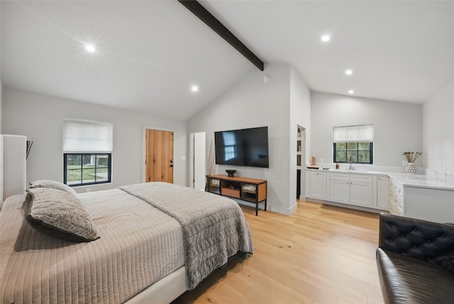 12203 Trailmaster Dr, Austin, TX 78737 - bedroom featuring beamed ceiling, light wood-type flooring, recessed lighting, a sink, and high vaulted ceiling