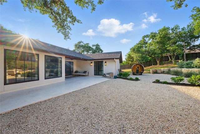 12203 Trailmaster Dr, Austin, TX 78737 - rear view of property with stucco siding and a patio