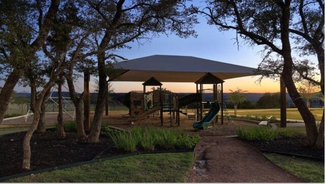 1912 Asti Ln, Leander, TX 78641 - view of playground at dusk