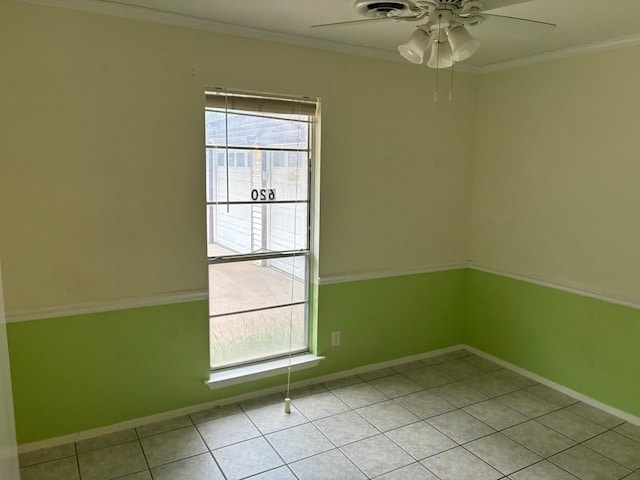 620 Amesbury Ln, Austin, TX 78752 - unfurnished room featuring ceiling fan, crown molding, baseboards, and light tile patterned flooring