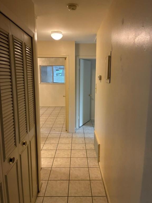 620 Amesbury Ln, Austin, TX 78752 - hallway featuring light tile patterned floors