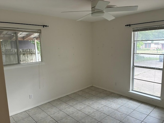 620 Amesbury Ln, Austin, TX 78752 - spare room featuring ceiling fan, plenty of natural light, and light tile patterned floors