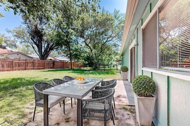 2508 Dovemeadow Dr, Austin, TX 78744 - fenced backyard featuring outdoor dining space and a patio