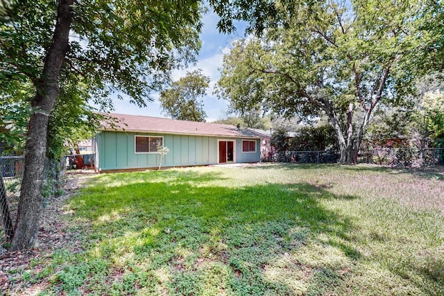 2508 Dovemeadow Dr, Austin, TX 78744 - view of front facade featuring a fenced backyard and board and batten siding