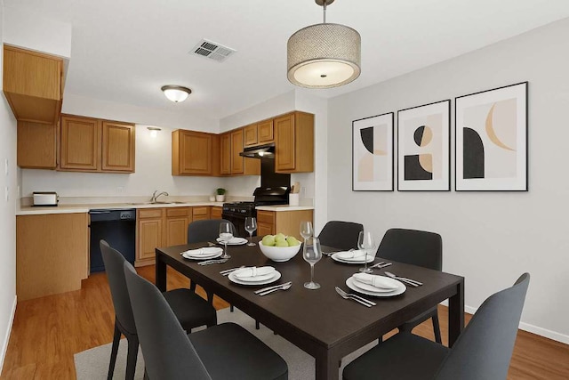 2508 Dovemeadow Dr, Austin, TX 78744 - dining space featuring wood finished floors