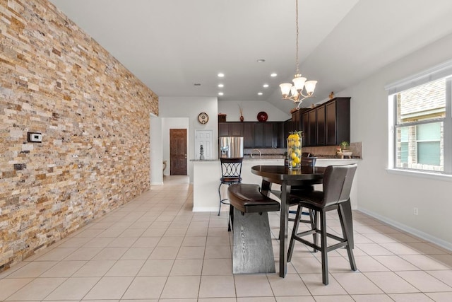 2204 Granite Hill Dr, Leander, TX 78641 - dining space with light tile patterned flooring, a chandelier, lofted ceiling, and recessed lighting