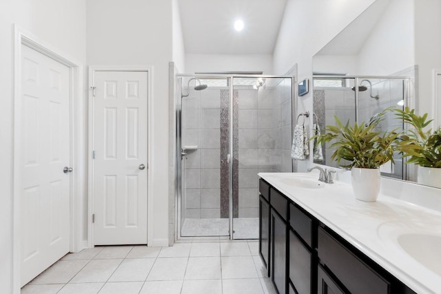 2204 Granite Hill Dr, Leander, TX 78641 - bathroom featuring a shower stall, double vanity, and tile patterned floors