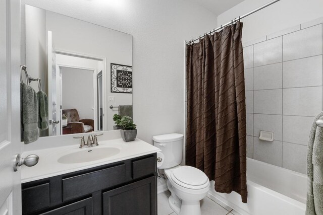 2204 Granite Hill Dr, Leander, TX 78641 - bathroom featuring vanity, toilet, shower / bath combo, ensuite bath, and tile patterned floors